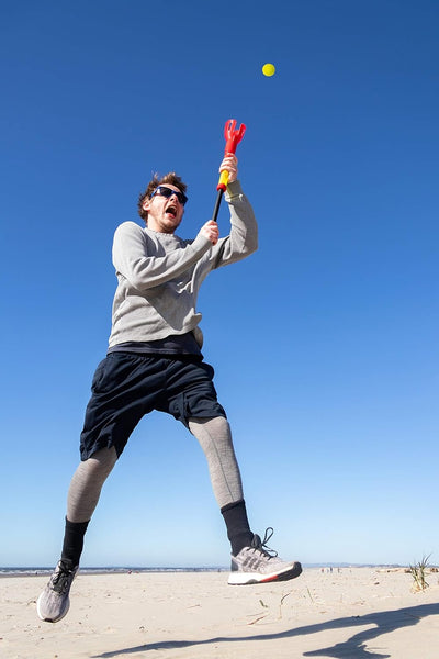 Hog Wild Pop and Pass Outdoor Game - Toss and Catch Foam Balls with The Launcher - Award-Winning Active Play - Includes 2 Launchers & 3 Foam Balls - Ages 6+