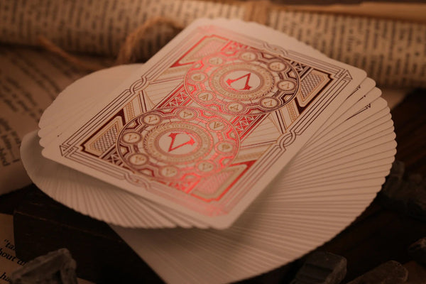 Room One Assassin's Creed Legacy Ver. II Playing Cards, Garnet Hidden Blade Edition, Poker Size Collectible Card Deck with Custom Artwork and Embossed Foil Sleeve, Red