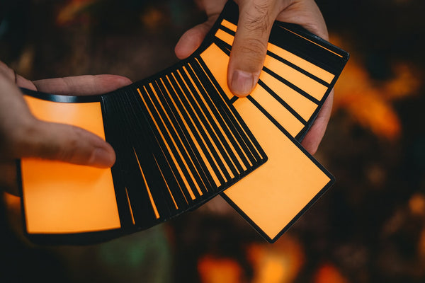 NOCtober Playing Cards - Halloween Neon Orange Deck that Glows Under Black Light - Cut-Out Jack-O’Lantern Tuck, Thin Crushed Finish, Poker Size Standard Index