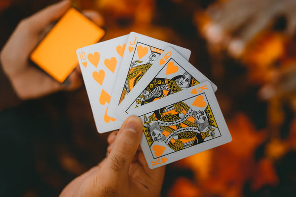 NOCtober Playing Cards - Halloween Neon Orange Deck that Glows Under Black Light - Cut-Out Jack-O’Lantern Tuck, Thin Crushed Finish, Poker Size Standard Index