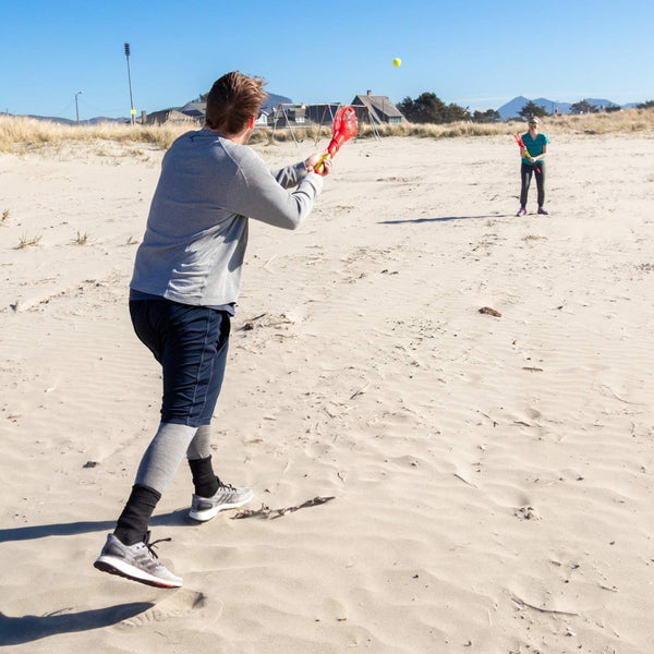 Hog Wild Pop and Pass Outdoor Game - Toss and Catch Foam Balls with The Launcher - Award-Winning Active Play - Includes 2 Launchers & 3 Foam Balls - Ages 6+