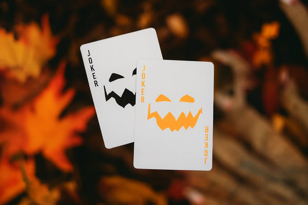 NOCtober Playing Cards - Halloween Neon Orange Deck that Glows Under Black Light - Cut-Out Jack-O’Lantern Tuck, Thin Crushed Finish, Poker Size Standard Index